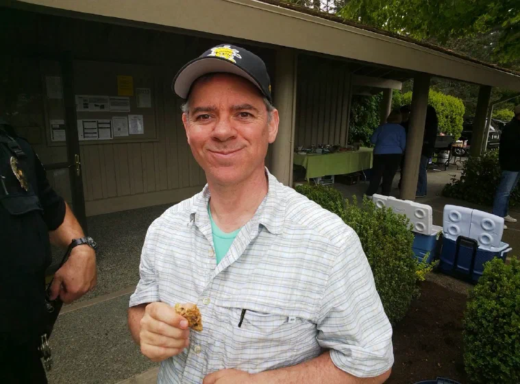 Mike smiling with a cookie