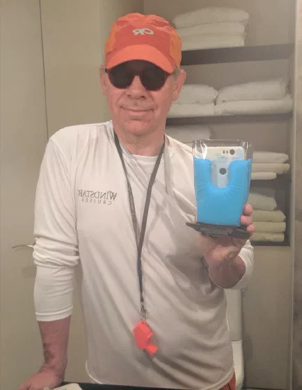Camp Counselor Mike holding a camera in waterproof housing