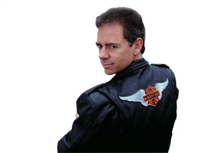 Mike wearing a leather jacket with a Recalc or Die patch