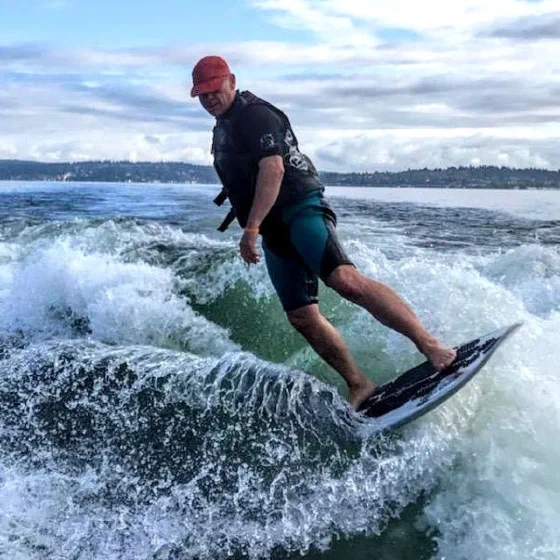 Mike surfing a boat wake