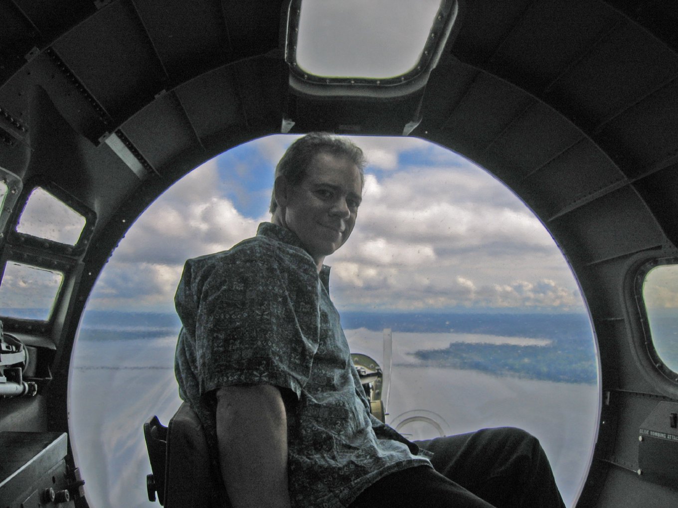 Looking out of the B-17's plexiglass nose, with the water far below