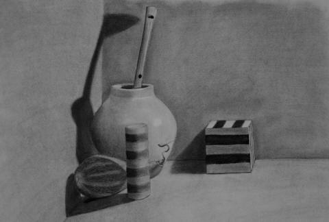 A charcoal still life of a vase with a paintbrush, a striped cylinder, a lemon and a striped box