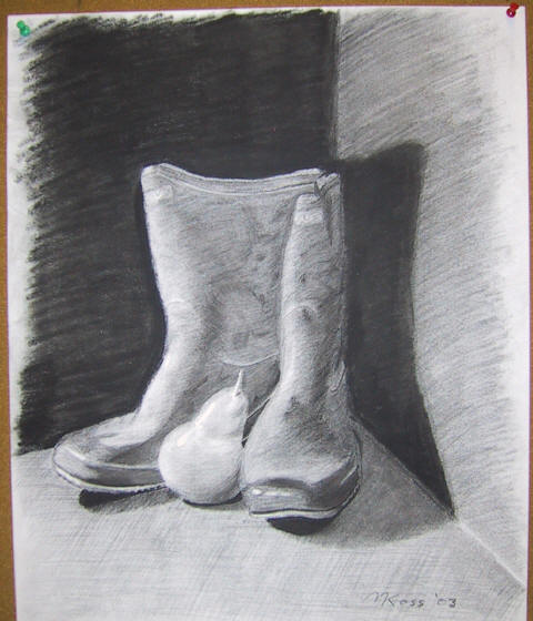 A charcoal drawing of a pair of boots and a pear in a dark box