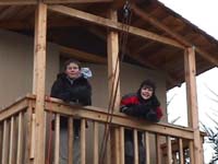 Two boys on the platform house balcony