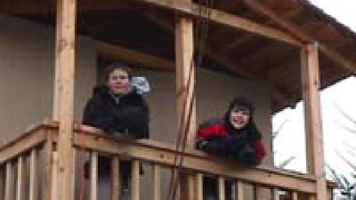 Chris and Will on the platform house balcony