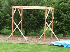 Four posts with Y-bracing holding the platform beams in the air