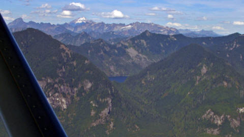 Rows of forested Cascade peaks seen from the air