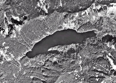 A black and white satellite photo of Lake Isabel among the mountains